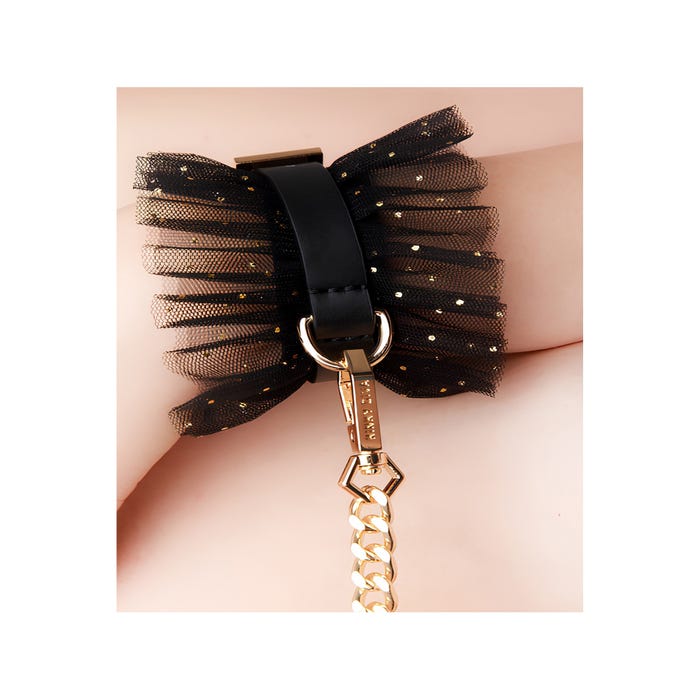 Menottes poignets tulle pailleté noir et or