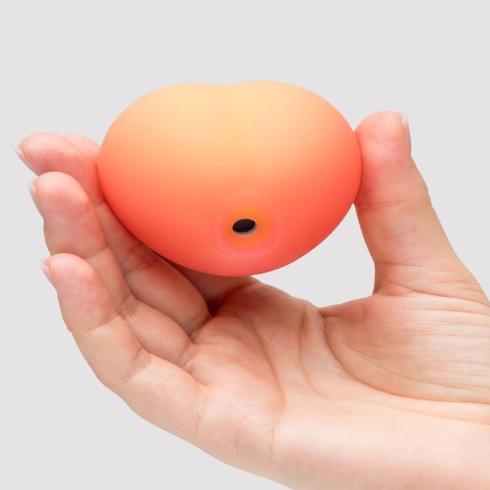 Womanizer Peach Toy stimulateur clitoridien