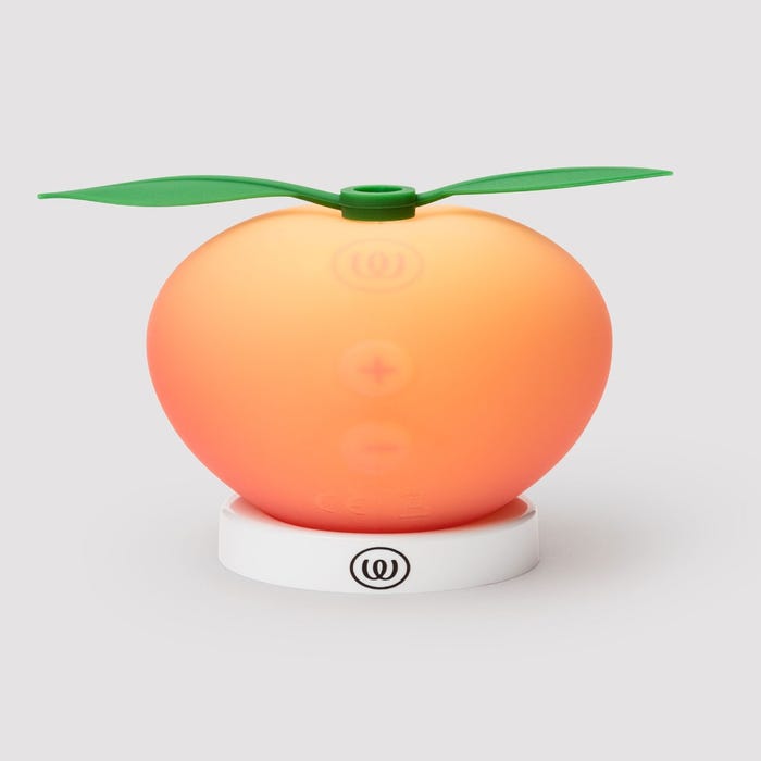 Womanizer Peach Toy stimulateur clitoridien